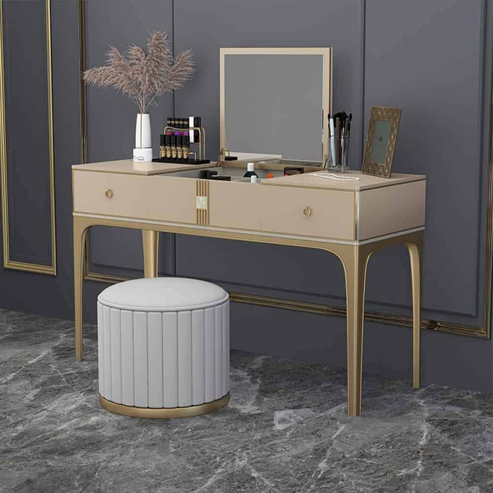 An elegant vanity design with a small mirror, good storage space, and a matching stool, in a gray room.