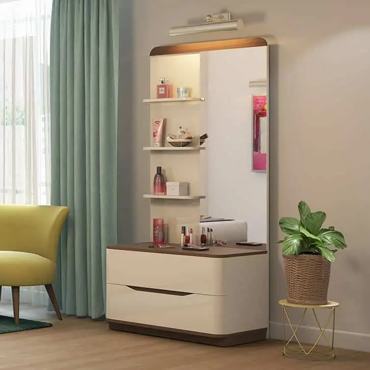 A stylish, wooden, white-colored dressing table design with a rectangular mirror and lots of storage space, in a white room.