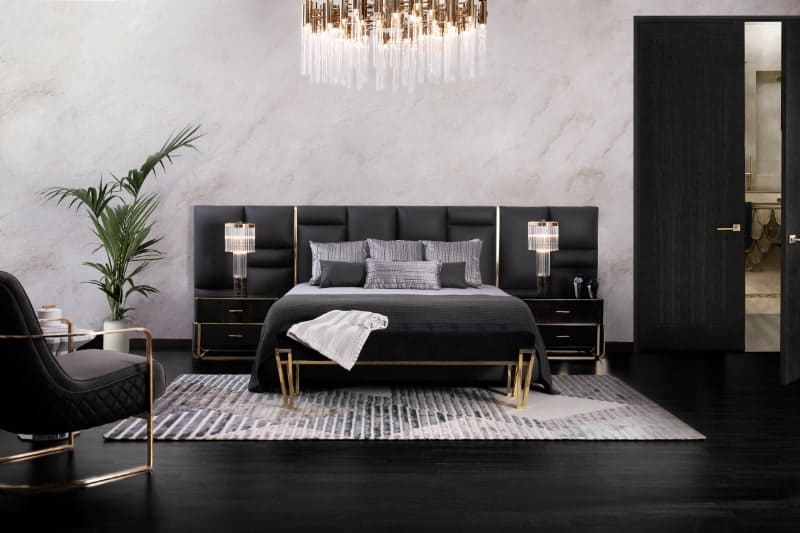 Luxurious home with Upholsted black colour bed with marble backdrop and gold detailing