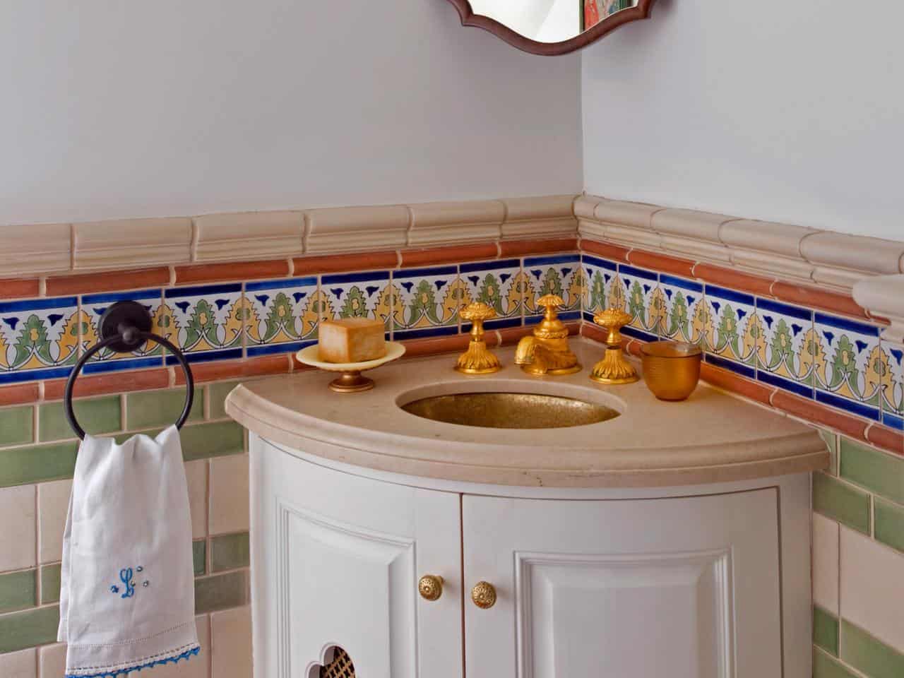Beautiful corner vanity with gold faucet detailing