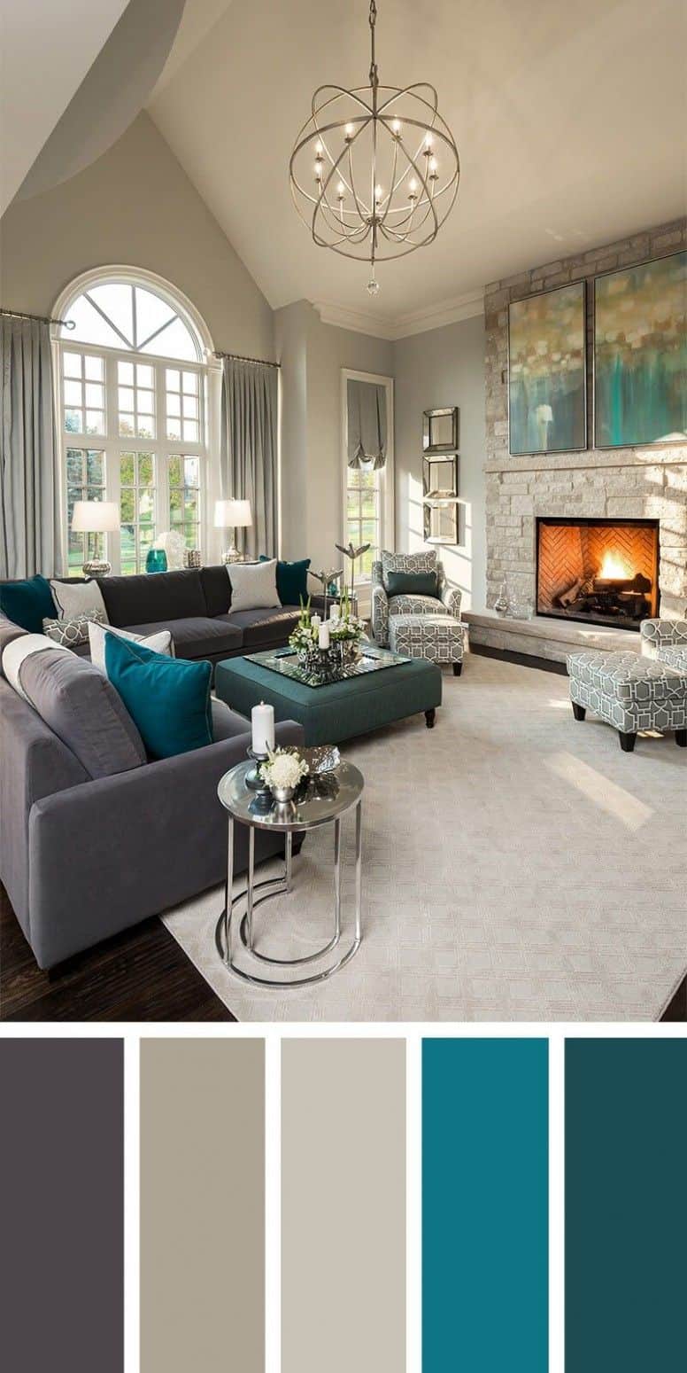 Home Colours of a living room with light grey walls, a dark grey sofa and blue cushions