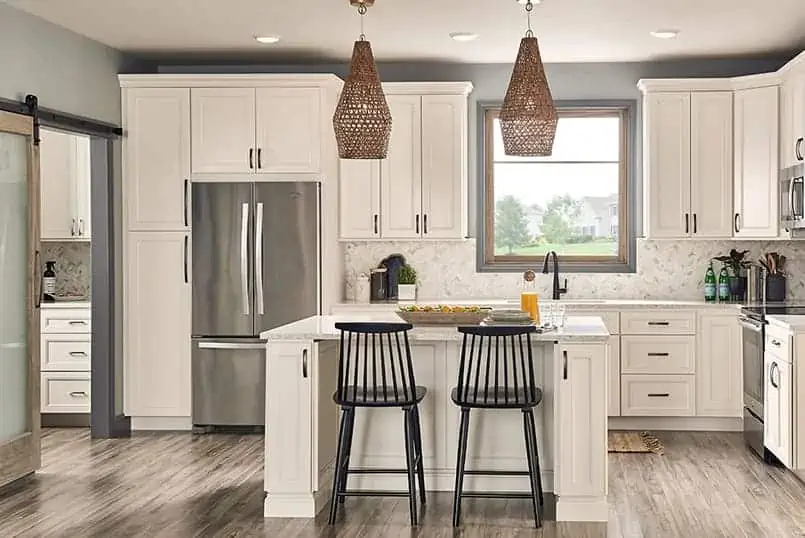 An elegant kitchen area with white kitchen island cabinets.