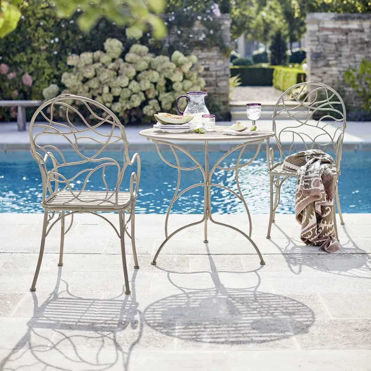  Metal garden chairs near swimming pool