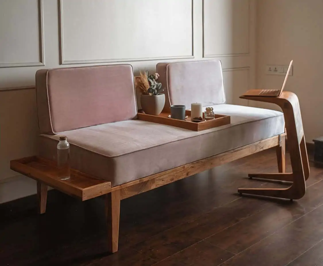 minimalistic sofa design in pink cushions with brown frame