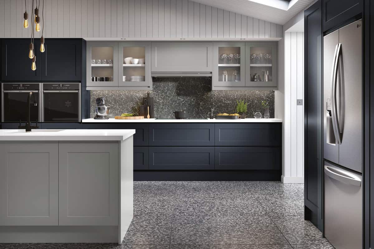 A simple black and grey-colored cabinetry with minimalistic designs in a big kitchen area.