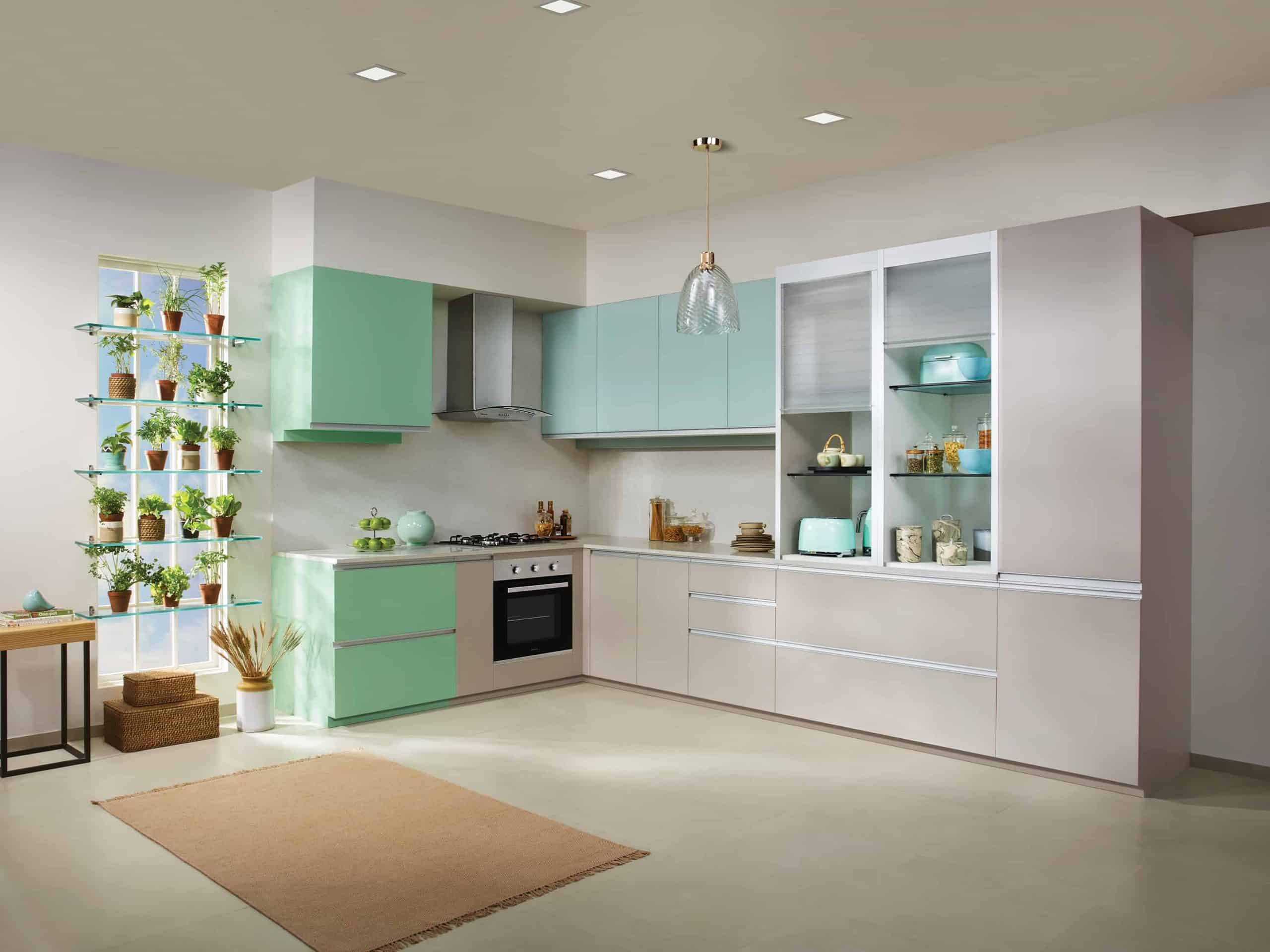 A cool white and green colored modern kitchen cabinet in a large kitchen area.