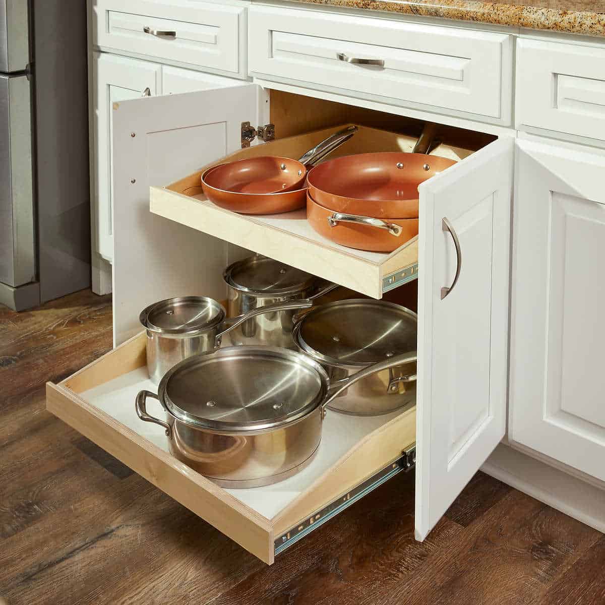A pull-out drawer holding some utensils.