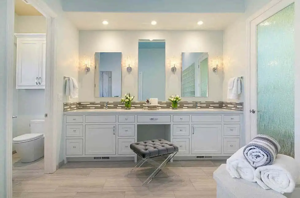 huge bathroom with three mirrors and ceiling lights