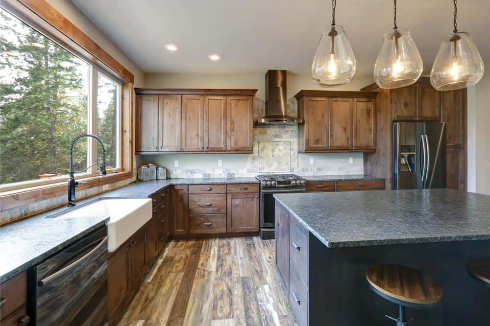 A vintage and rustic kitchen cabinet design in a large kitchen area.