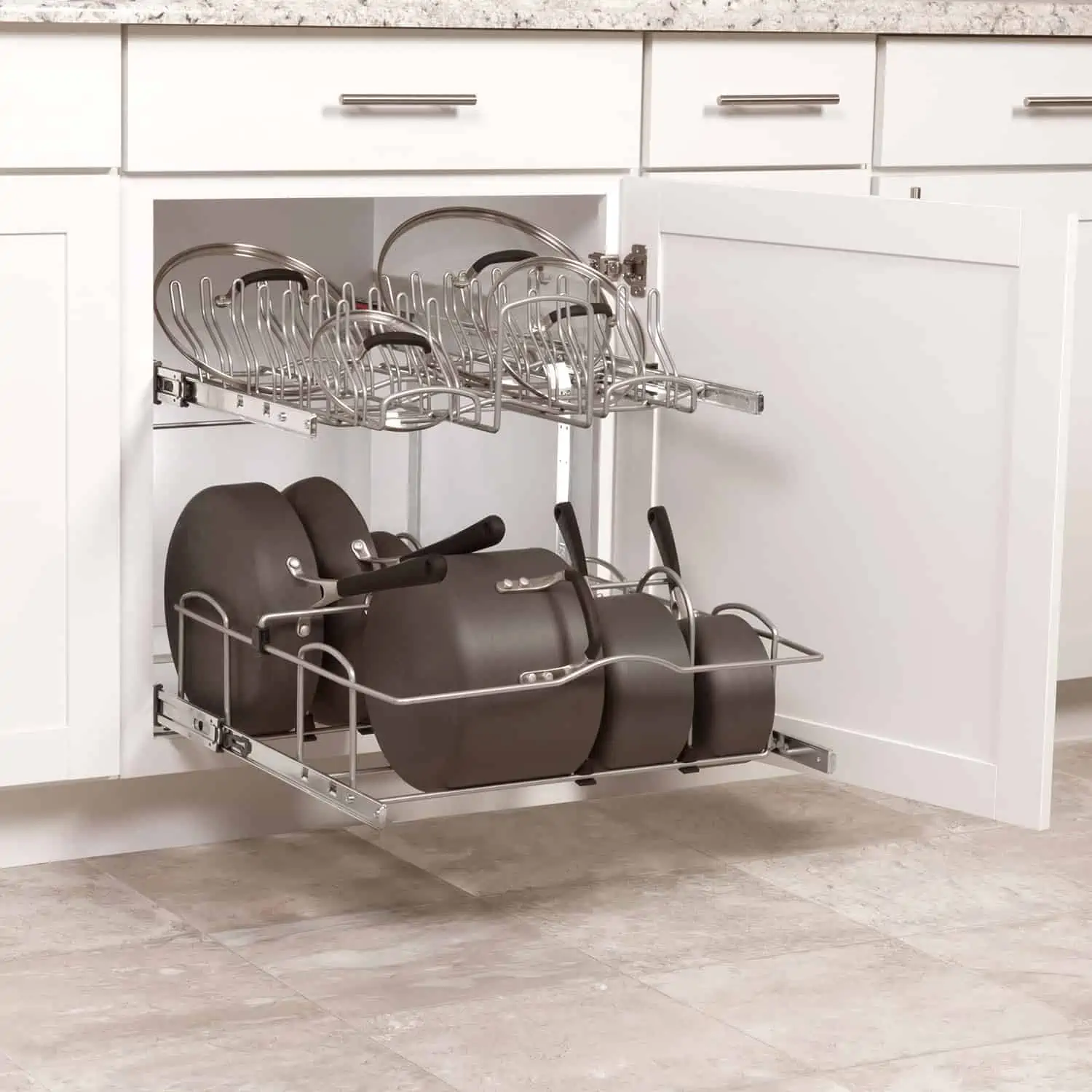 Shelf organizers of a cabinetry displaying some utensils.