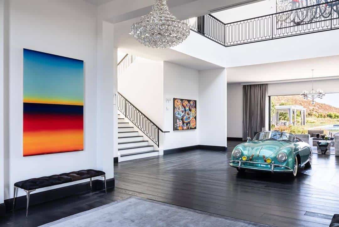 large foyer with colourful artwork and blue convertible installation