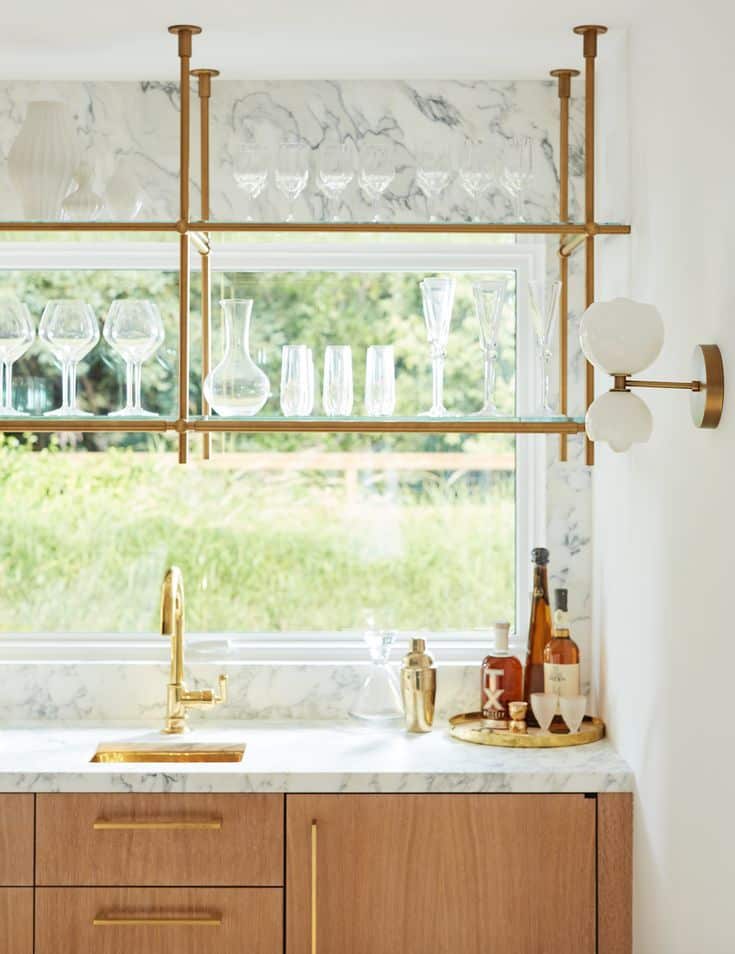 Modern kitchen with top hung shelves for storing glassware