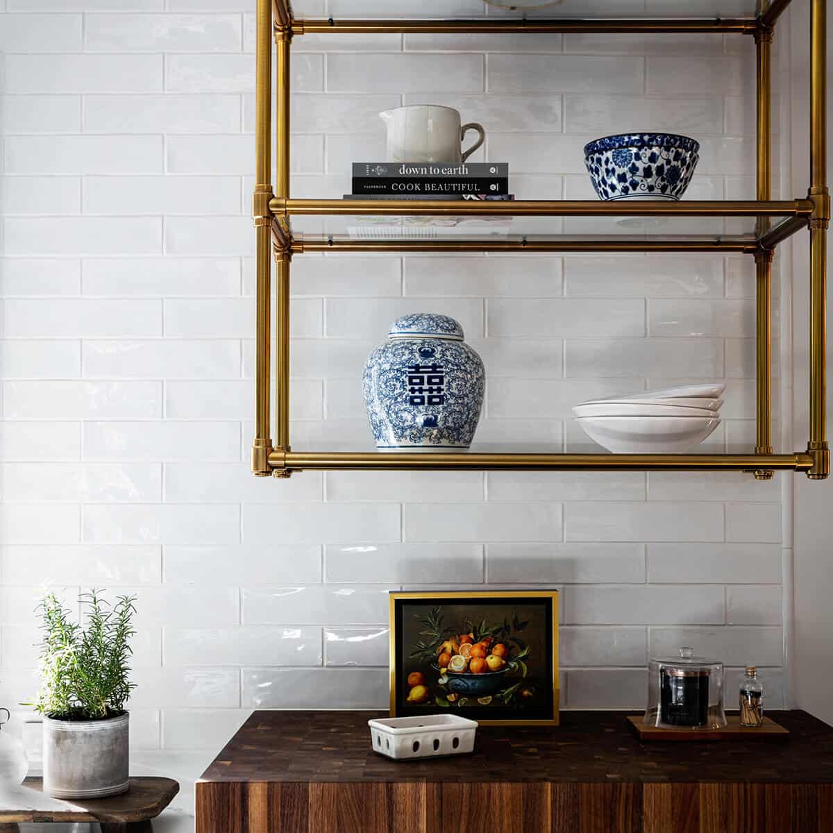 Modern kitchen with top hung shelves for storing glassware and ceramics