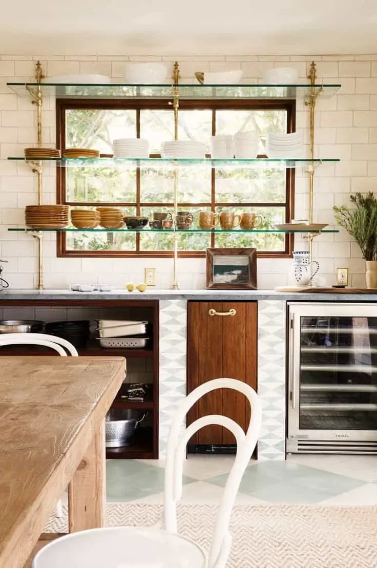 Modern kitchen with top hung shelves for storing glassware and ceramics