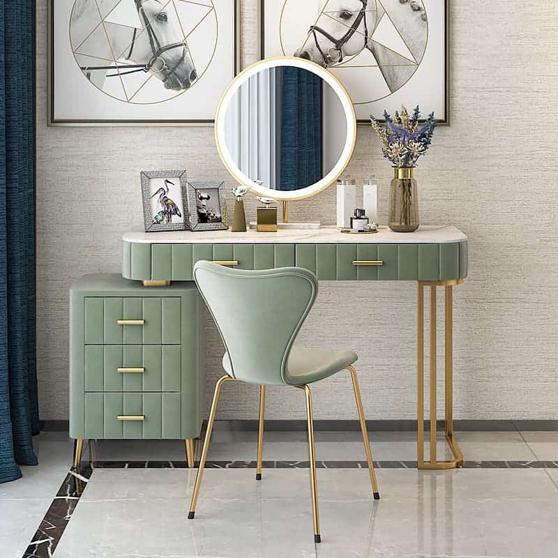 A chic dressing table design with a round mirror, ring lights, storage drawers, and a matching chair, in a white room.