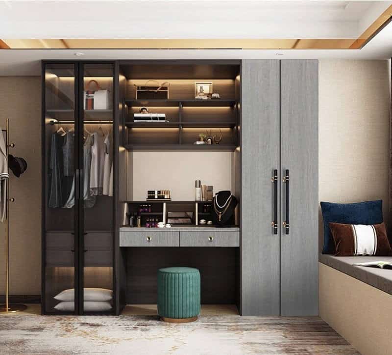 grey closet with glass doors a mirror and seating arrangement