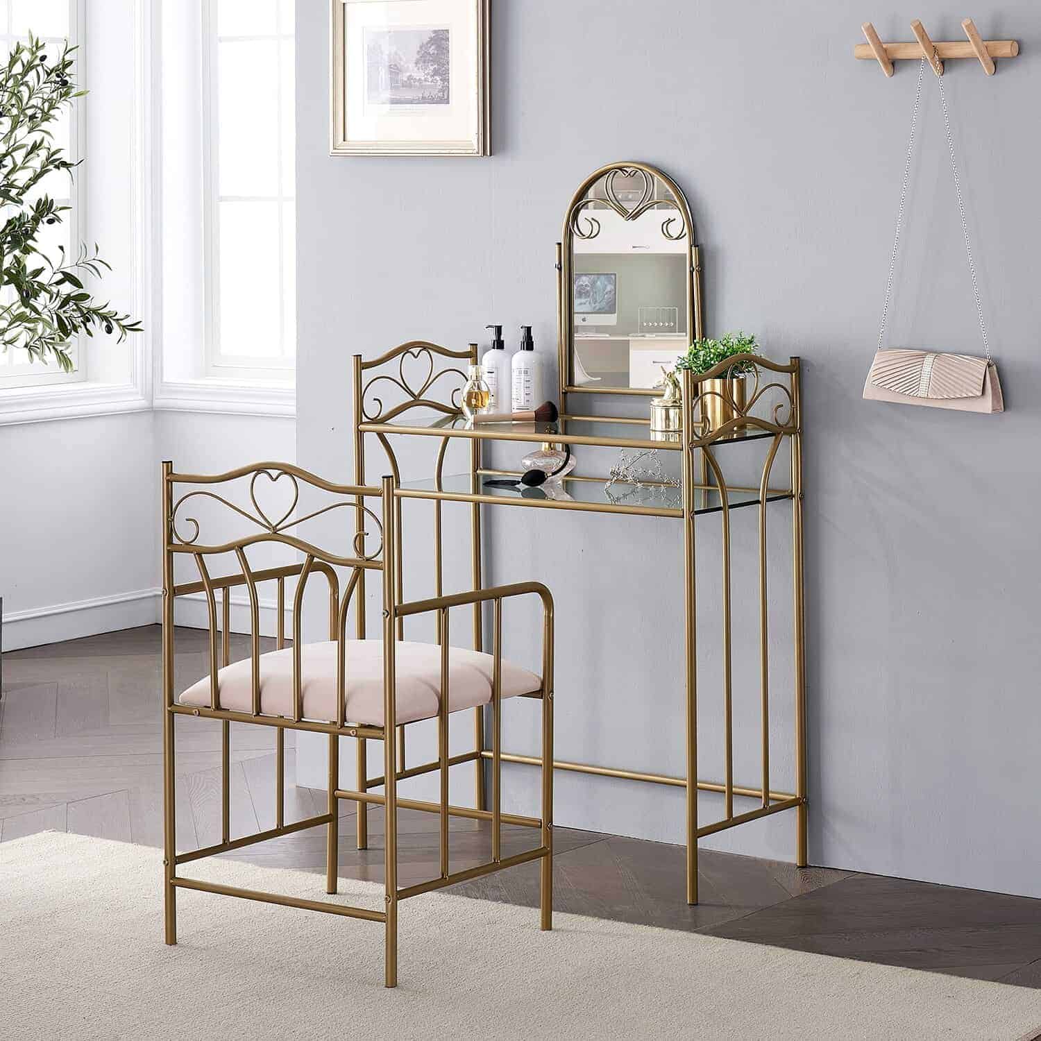 An elegant metallic dresser with a matching chair, kept in a well-lit room.
