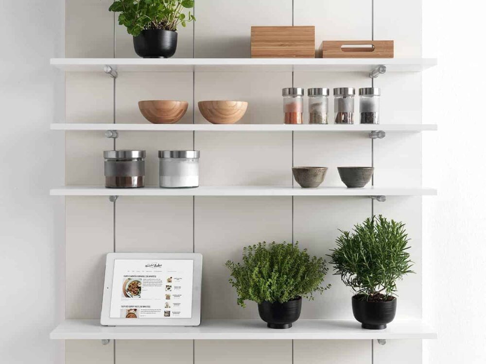 Salice Pin shelf with decor elements such as indoors planters, books, bowls, frame