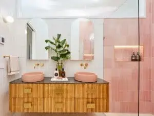 Wooden wall mounted vanity with twin pink sink bowl