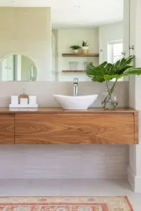 Wall mounted wooden vanity with ceramic bowl sink