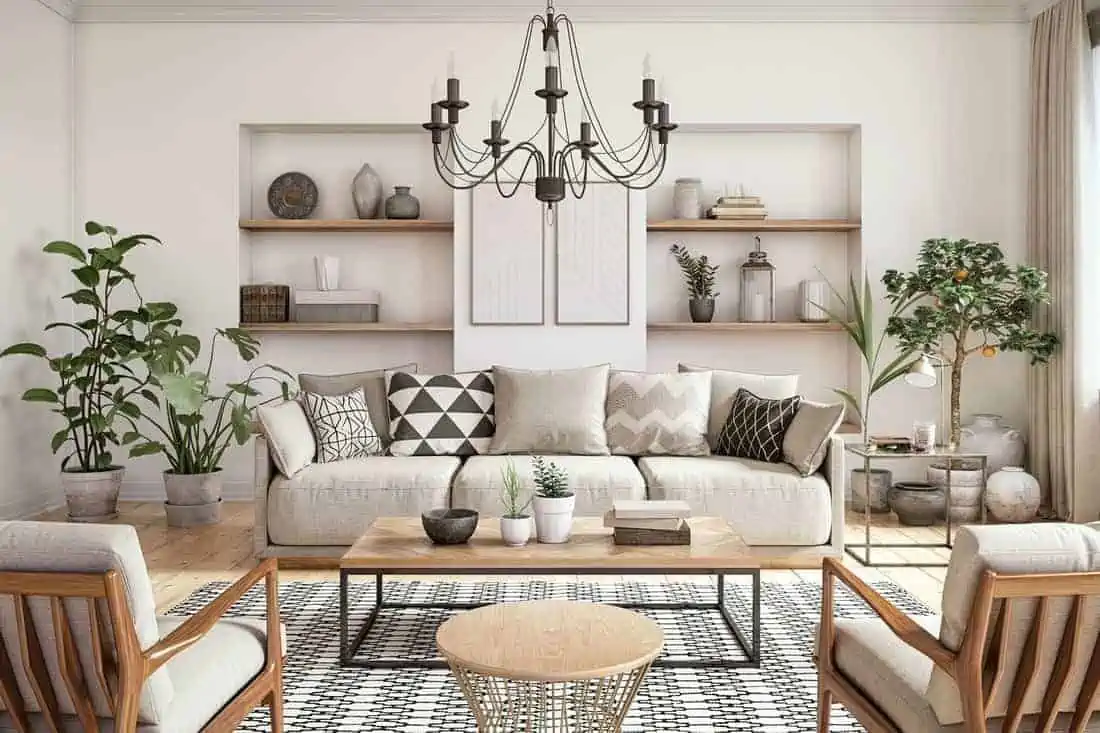 white walls in a living room with sofa, chair, ceiling light and plants