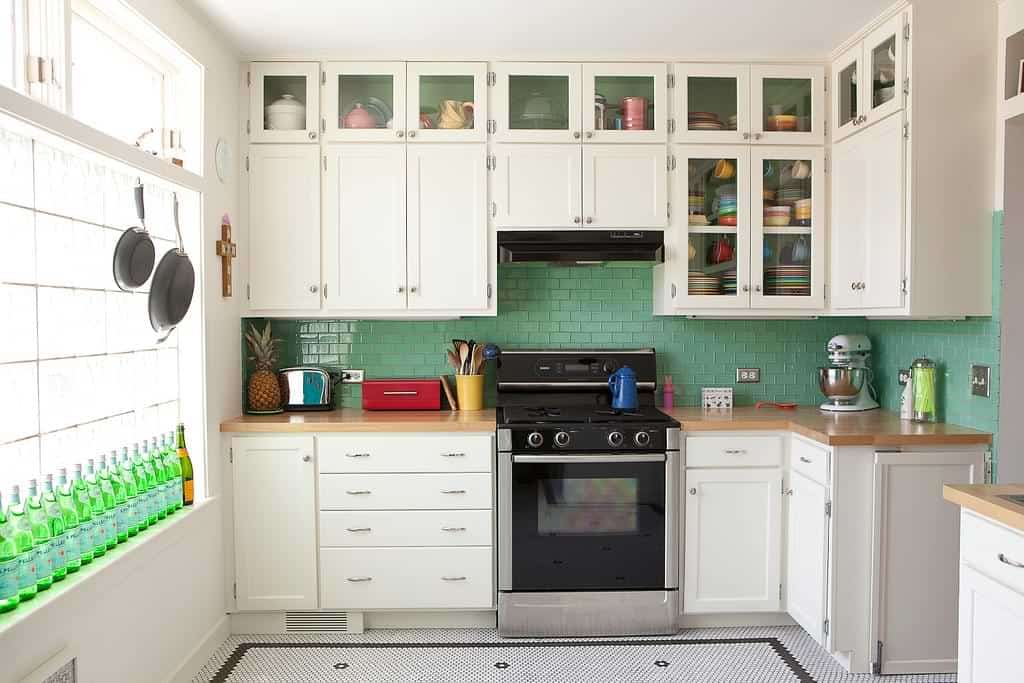 kitchen with easy to clean glossy backsplash white tiles