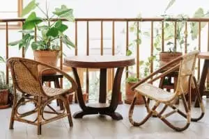 rattan chair, table, plant in balcony