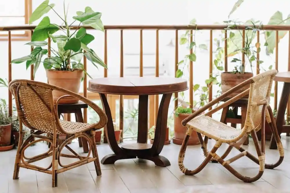 rattan chair, table, plant in balcony