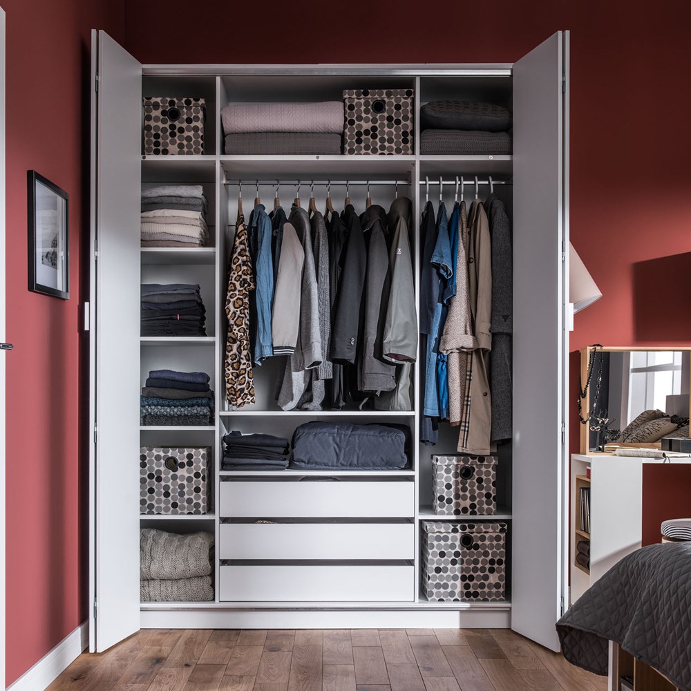 white folding door wardrobe in a bedroom