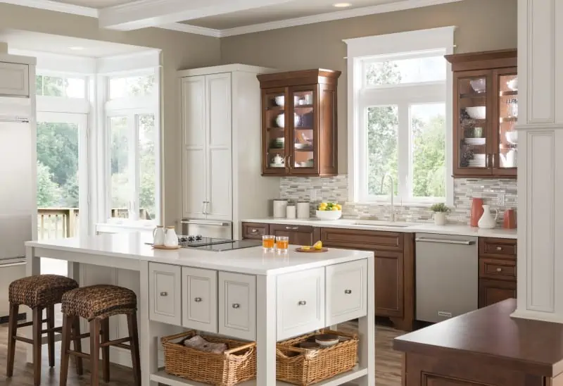 A modern kitchen space surrounded by windows and best furniture.