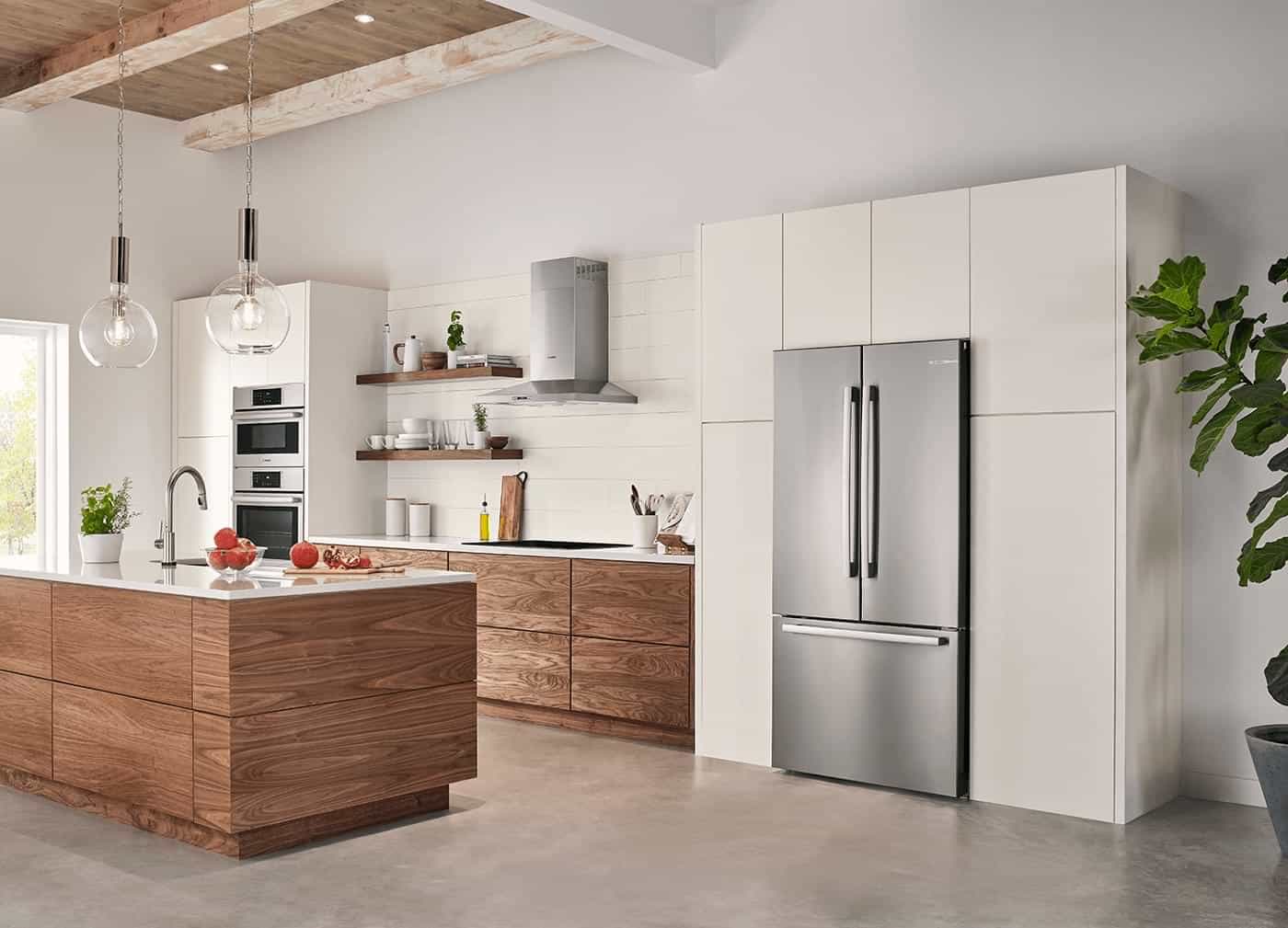 built in appliances in a kitchen with brown cabinets