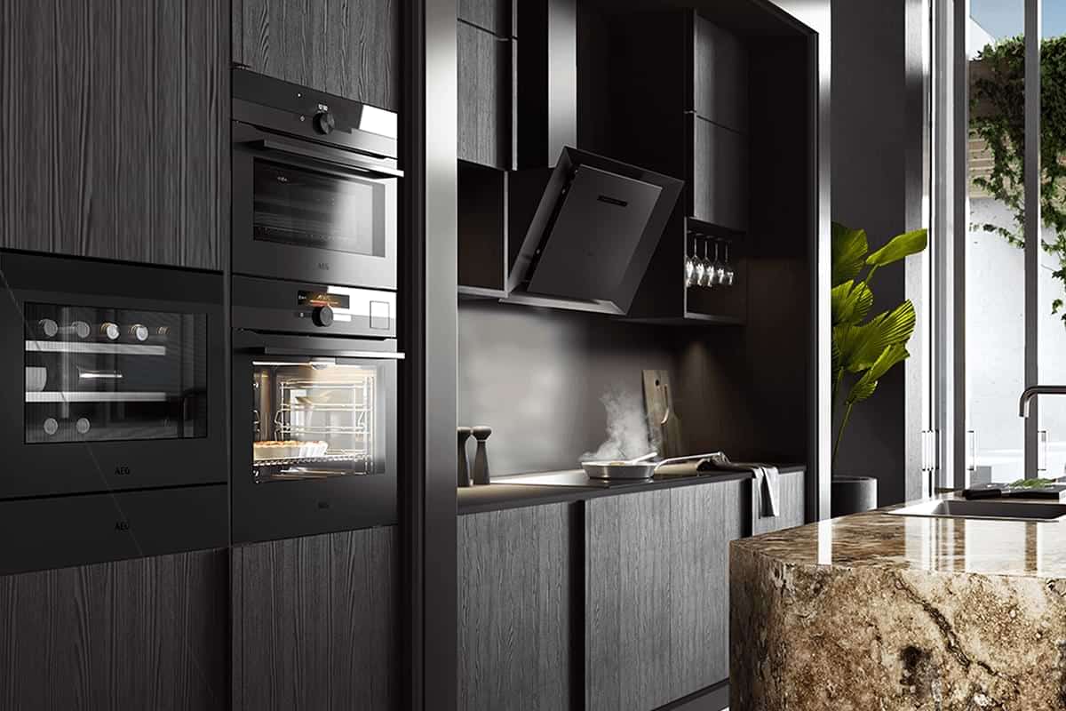 built in appliances in a kitchen with black cabinets