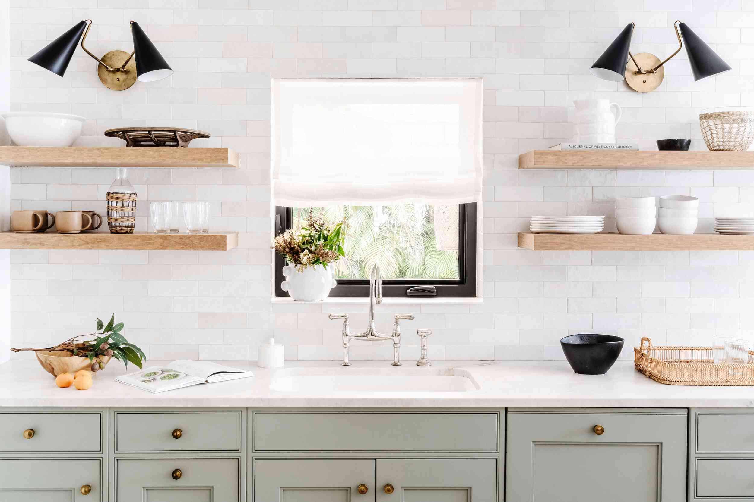 Modern white kitchen design with display shelves