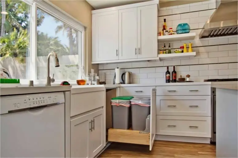 Intelligent dealing with trash in a modern kitchen with wall tiles.