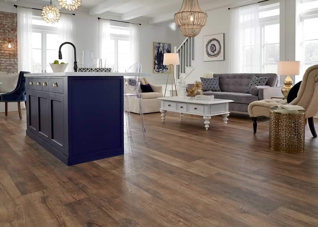 Laminate wood flooring in kitchen ، living room