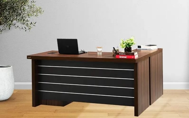 laminate and plywood executive office table with laptop and flowers
