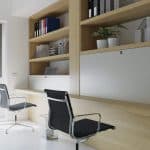 wooden desk, shelves, cabinets and black metal chairs