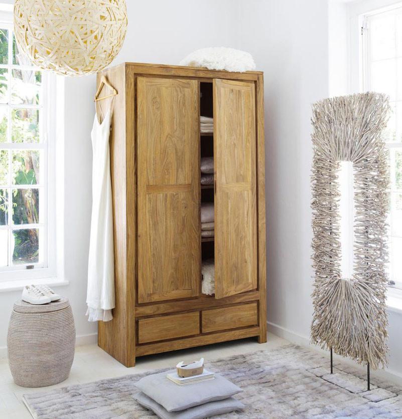 brown solid wood closet in a bedroom with a rug and table