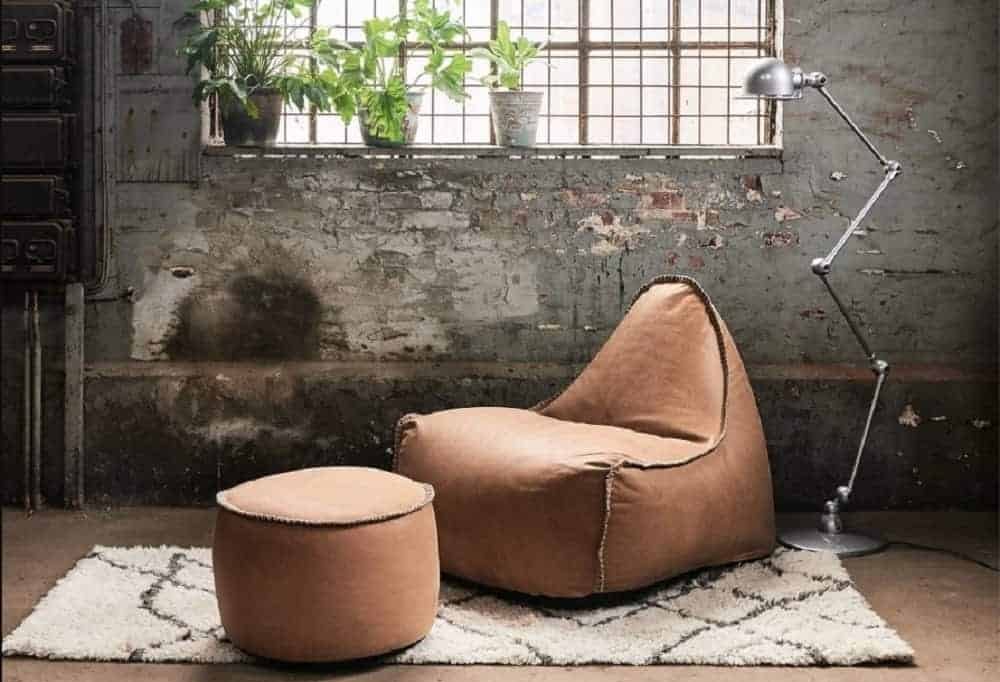 brown leather beanbag in distressed design setting