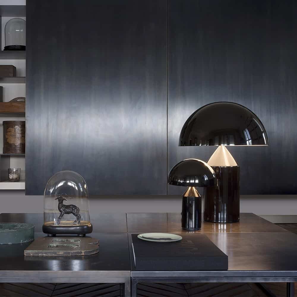 black table lamp in a living room with table and shelves