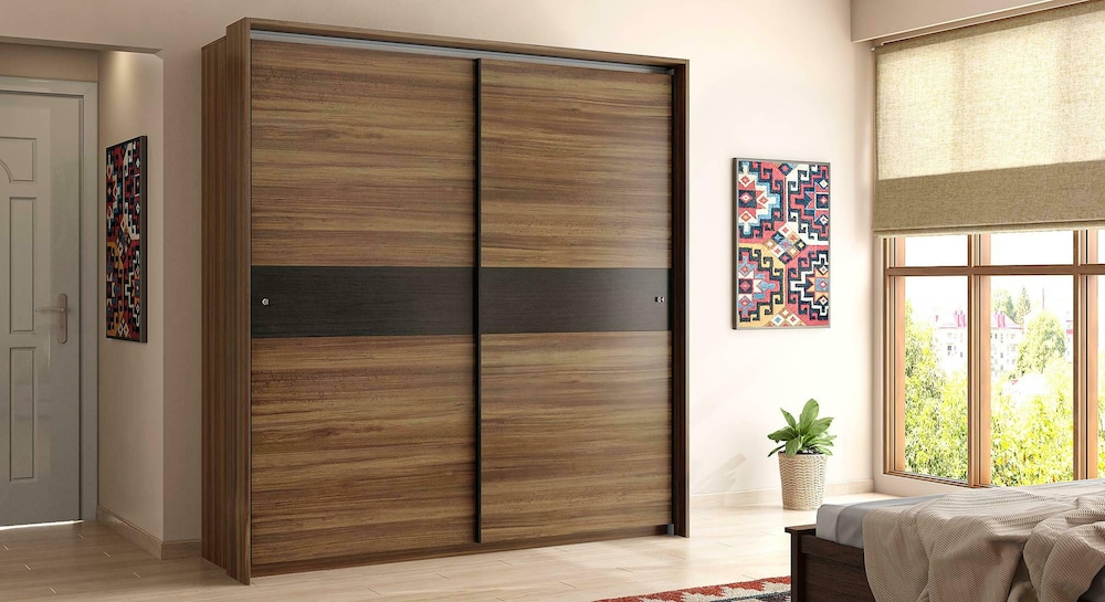 brown engineered wood wardrobe & cupboard design in a modern bedroom