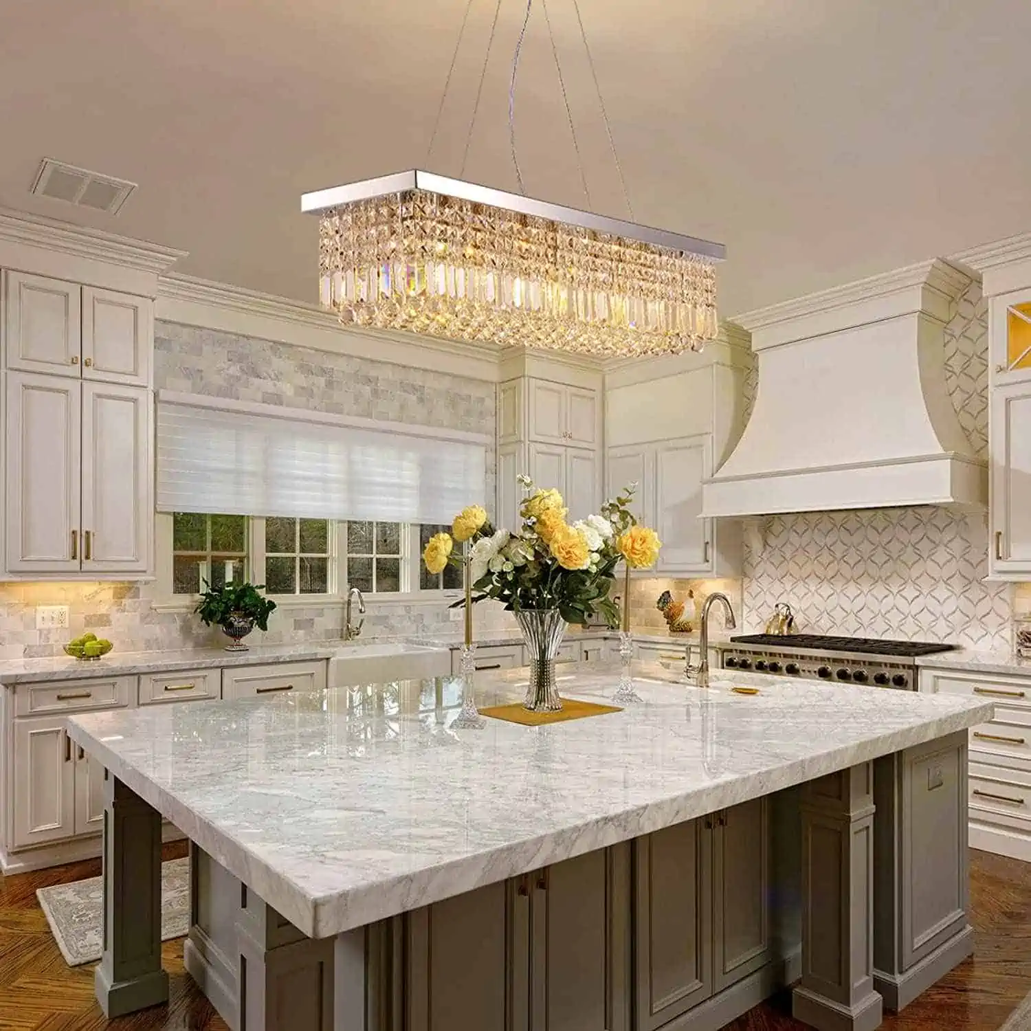 white kitchen with , counter, chandelier