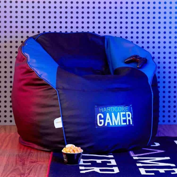 Black faux leather gamer set in a space with neon lightschair