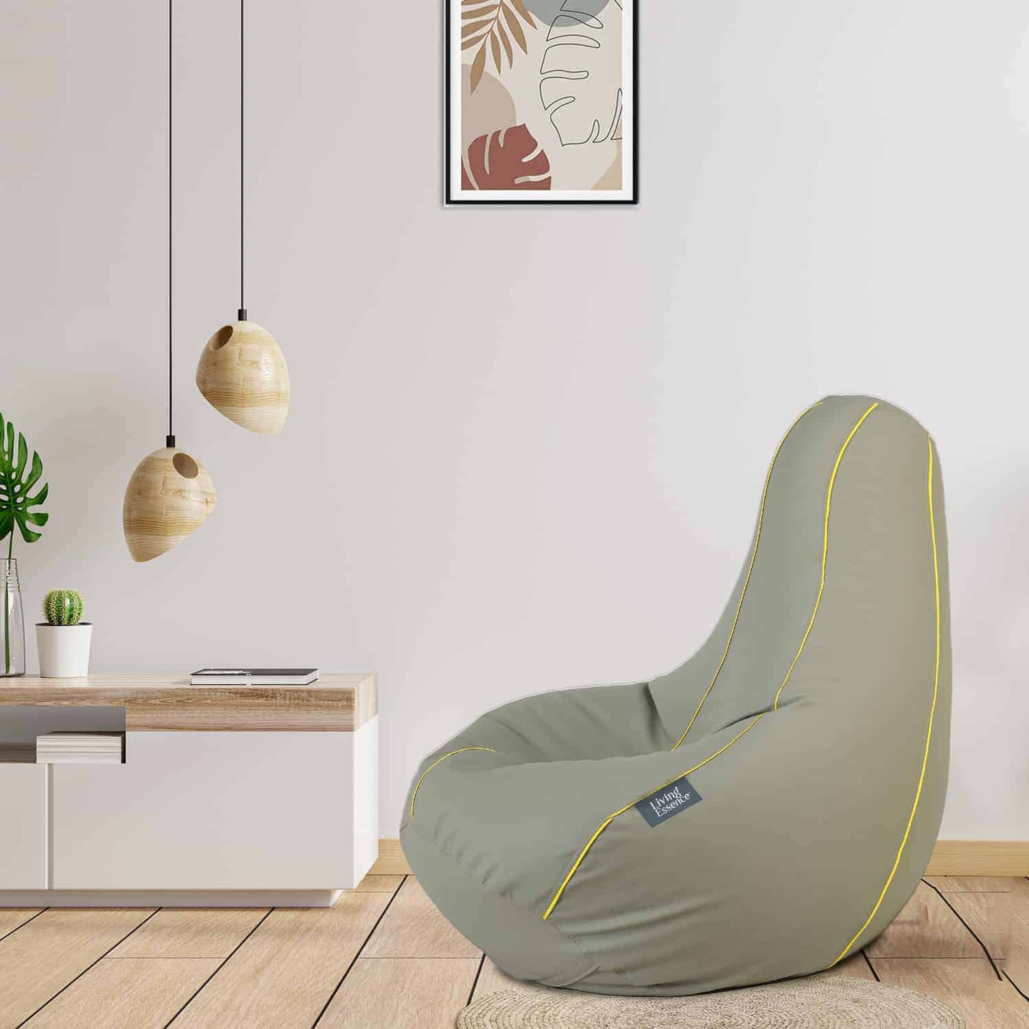 Grey leatherette giant bean bag chair with wooden flooring and pendant lights