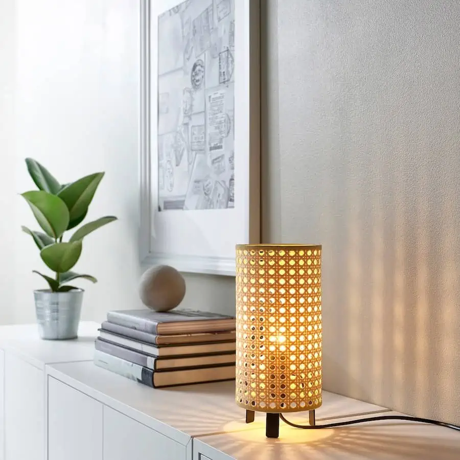 white table with books, plant and lamp