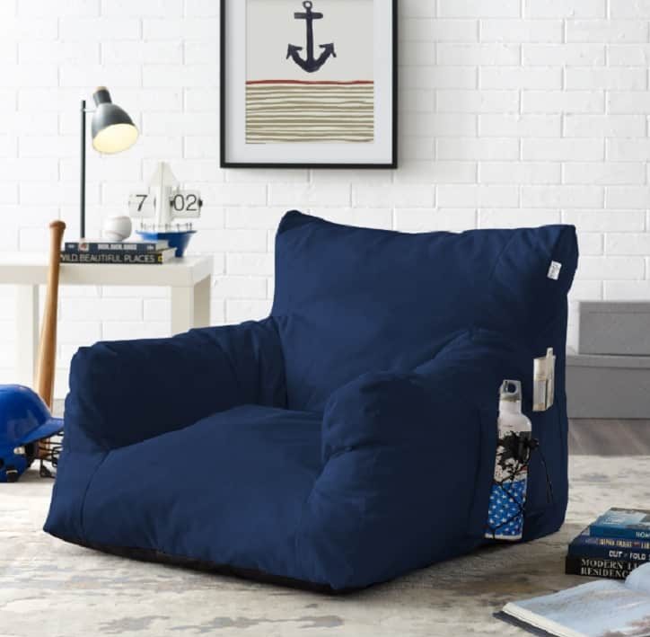 dark blue nylon seater on carpeted floor with anchor picture on the wall