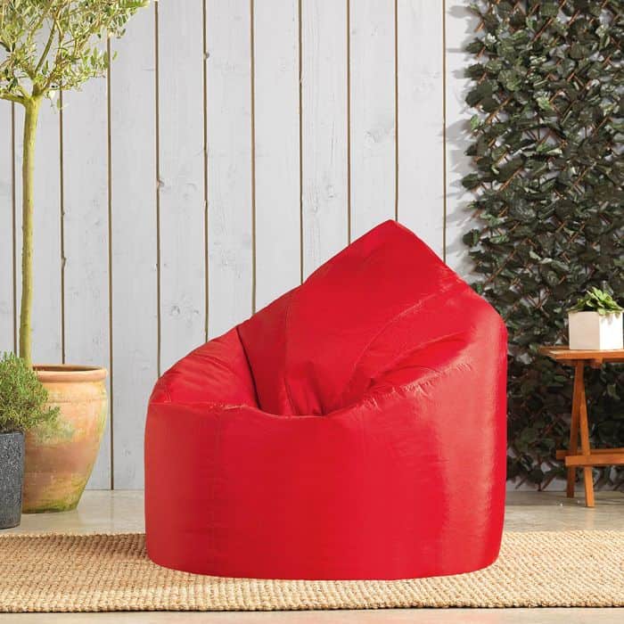 red bean bag for teenagers with textured wall and wooden flooring