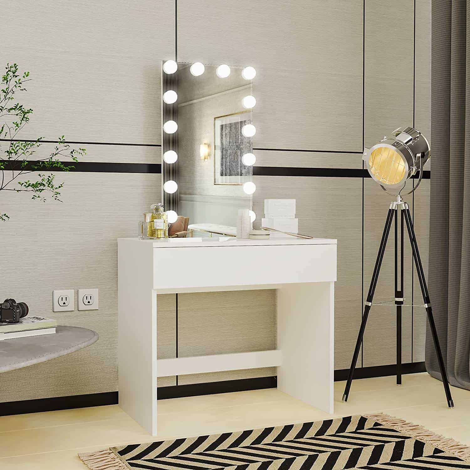 white vintage vanity with lights and printed carpet and retro floor lamp