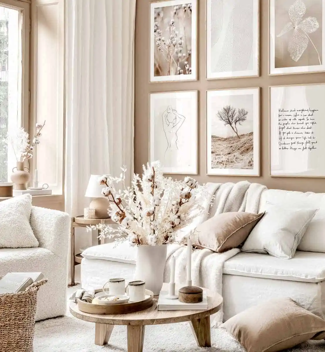 living room with white sofa, brown table and wall paintings