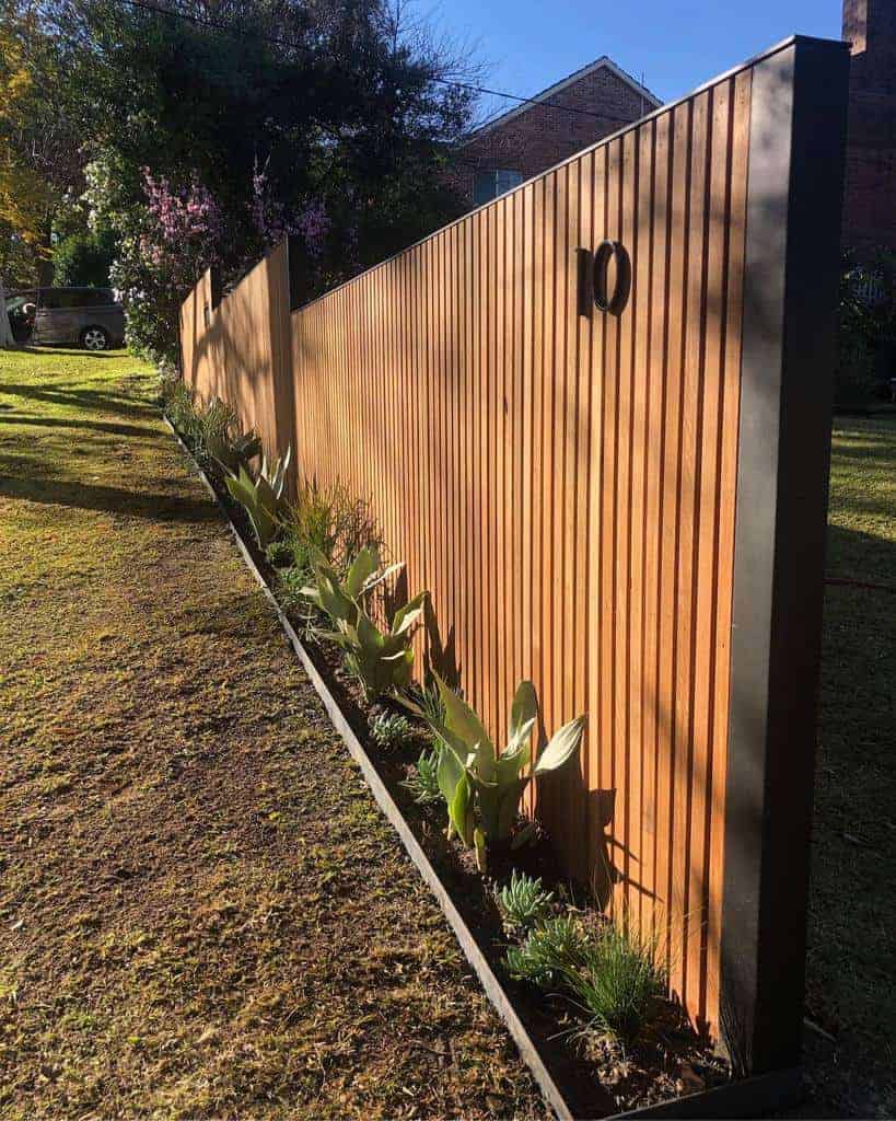 wooden planks arranged together to give modern look to the compound wall design